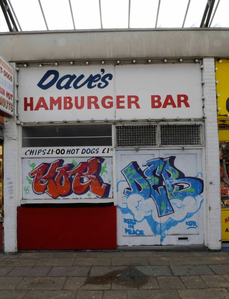 Many of the shops have now been daubed with graffiti