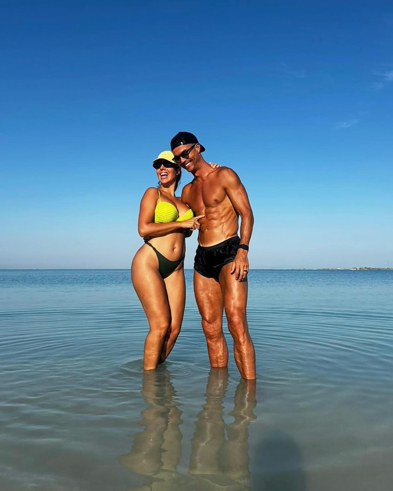 She and Ronaldo were smiling with delight as they posed in the sea