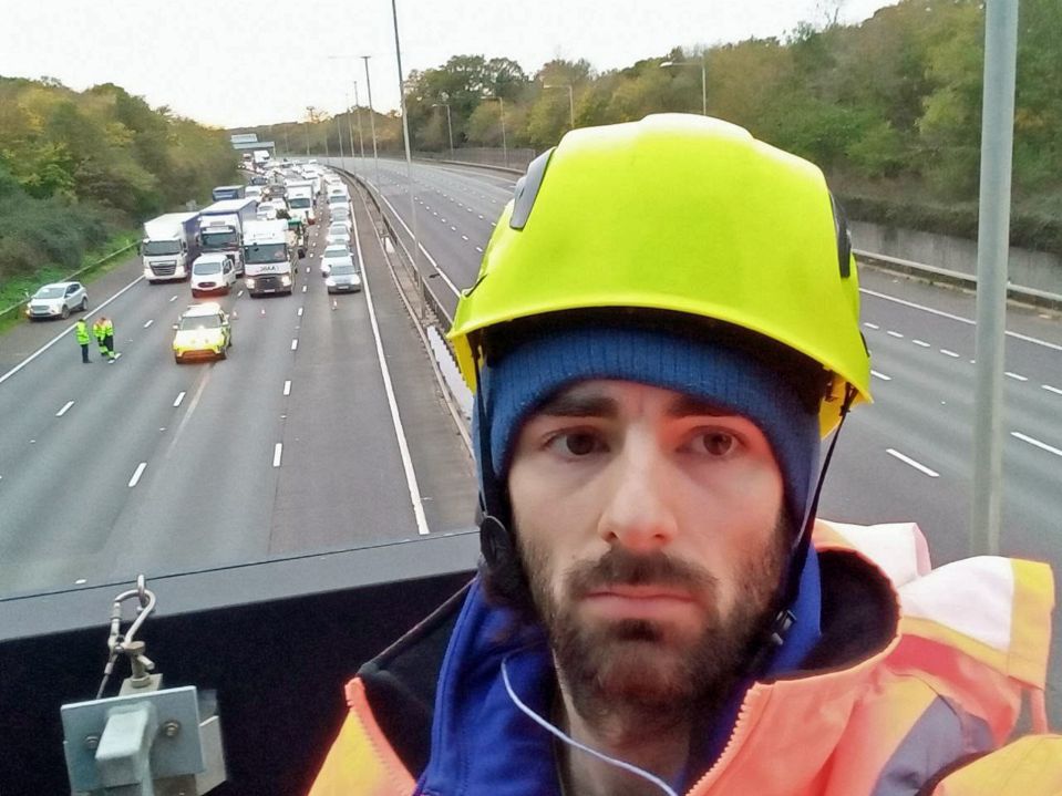 A JSO protester on a gantry