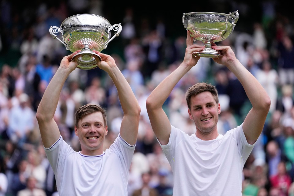 Harri Heliovaara and Henry Patten lift their trophies