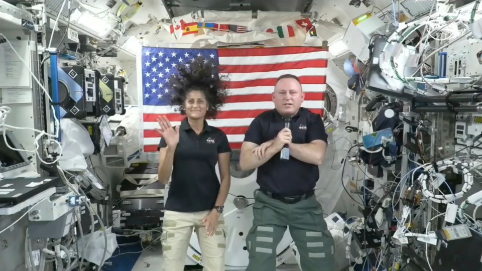 Astronauts Suni Williams, left, and Butch Wilmore give a news conference aboard the ISS on Wednesday