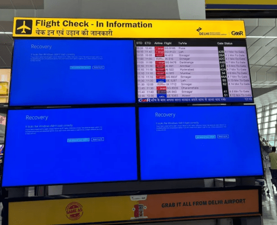 a flight check-in information board at an airport