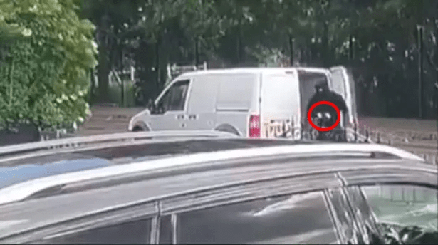 a white van is parked next to a black suv