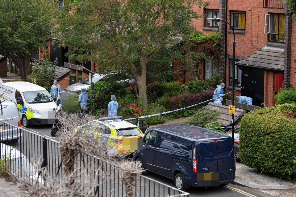 a blue van is parked in front of a police car