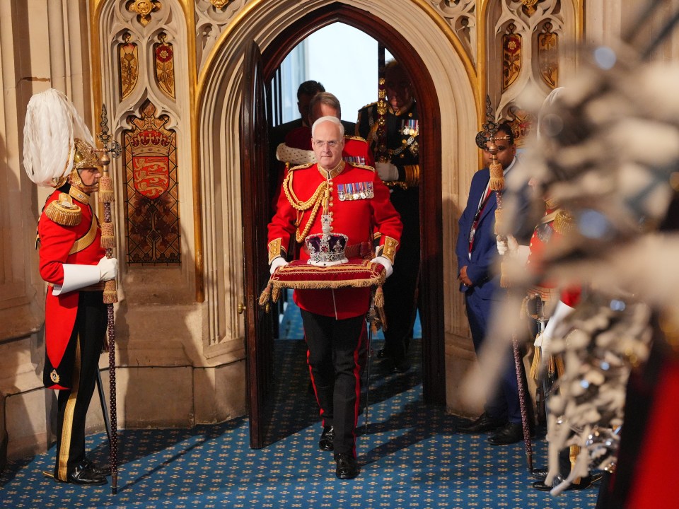 The Imperial State Crown is carried into the House of Lords