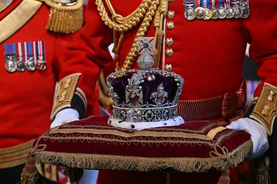 The Imperial State Crown is carried through the Norman Porch ahead of the State Opening of Parliament