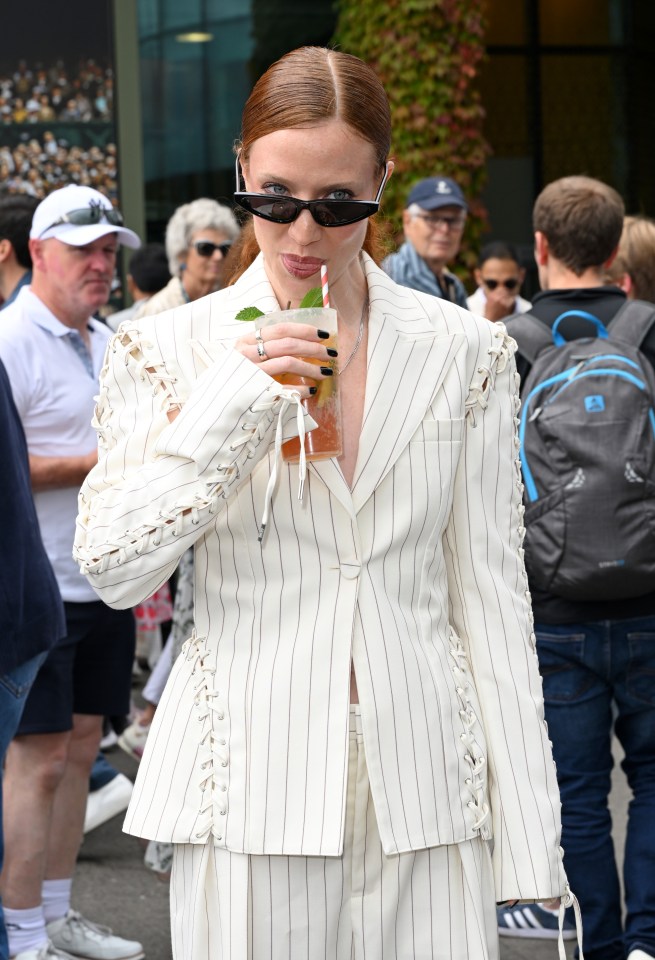 Jess Glynne went for a bold pinstripe number as she sipped on Pimm's