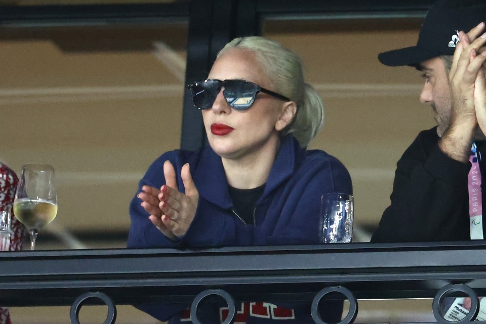 Lady Gaga pulled on a pair of sunglasses as she witnessed the action at Paris' Bercy Arena