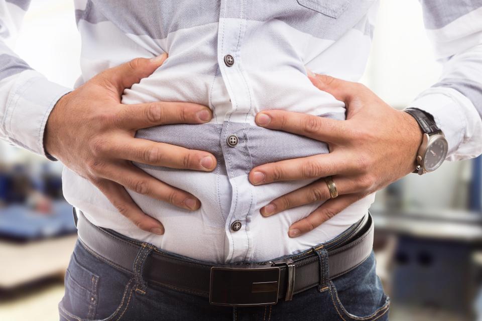 Stomach pain or bloating can be a sign of cancer (stock image)