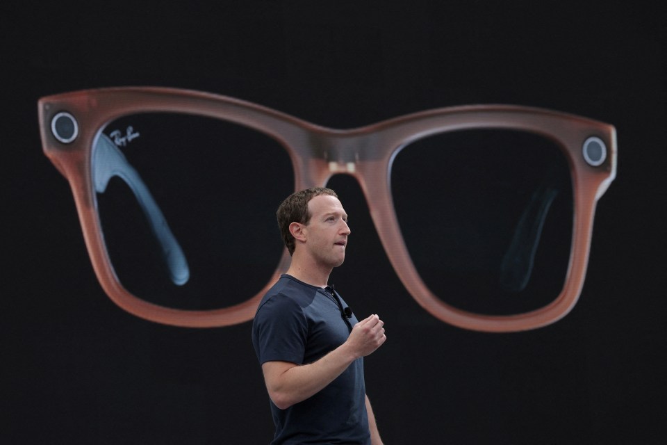 a man stands in front of a pair of ray-ban sunglasses