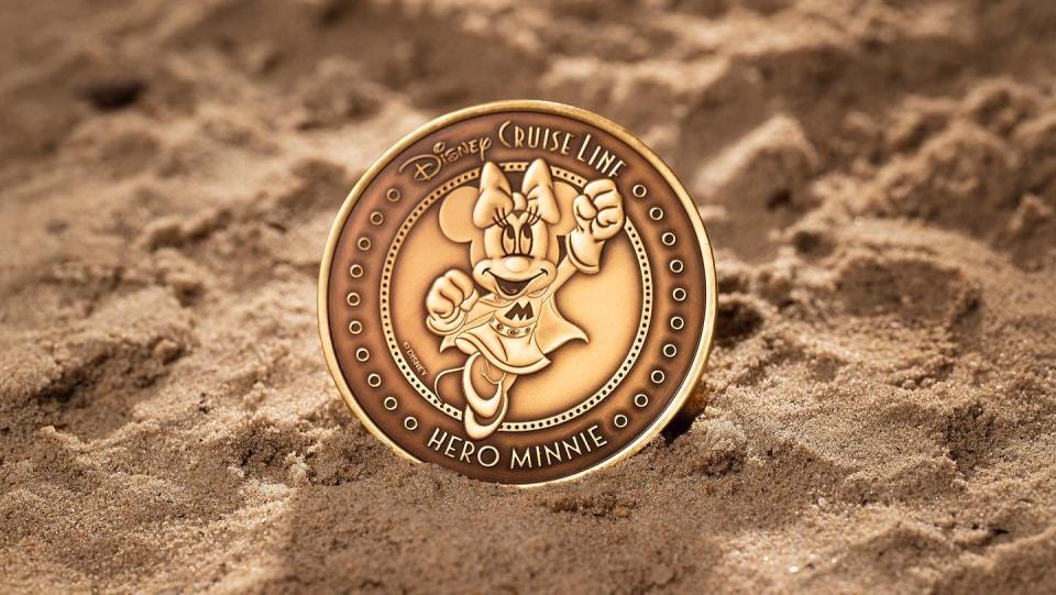 a disney cruise line coin with minnie mouse on it