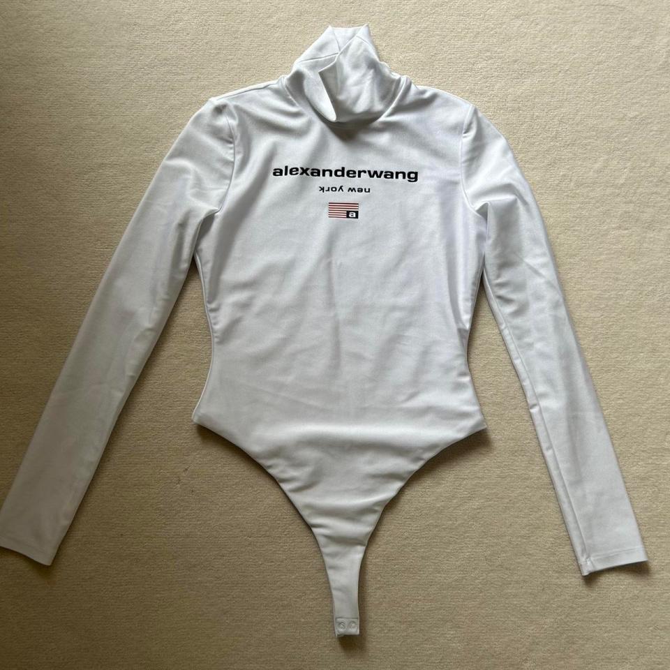 a white alexander wang bodysuit with long sleeves