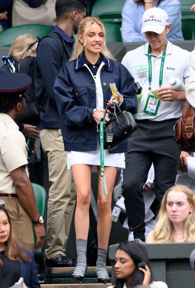 Riddle rocked a dress and navy jacket with grey heels at Wimbledon