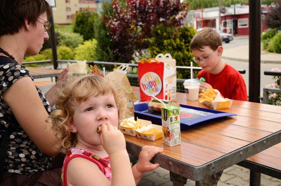 Children enjoying a McDonald's Happy Meal