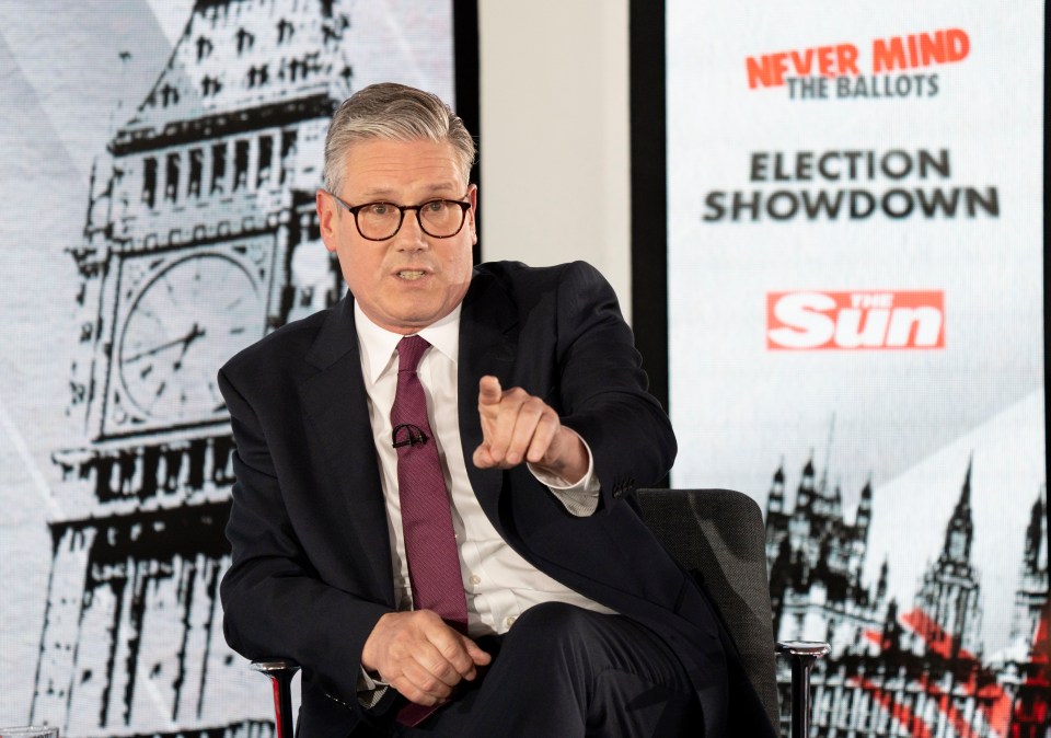 a man sitting in front of a sign that says never mind the ballots