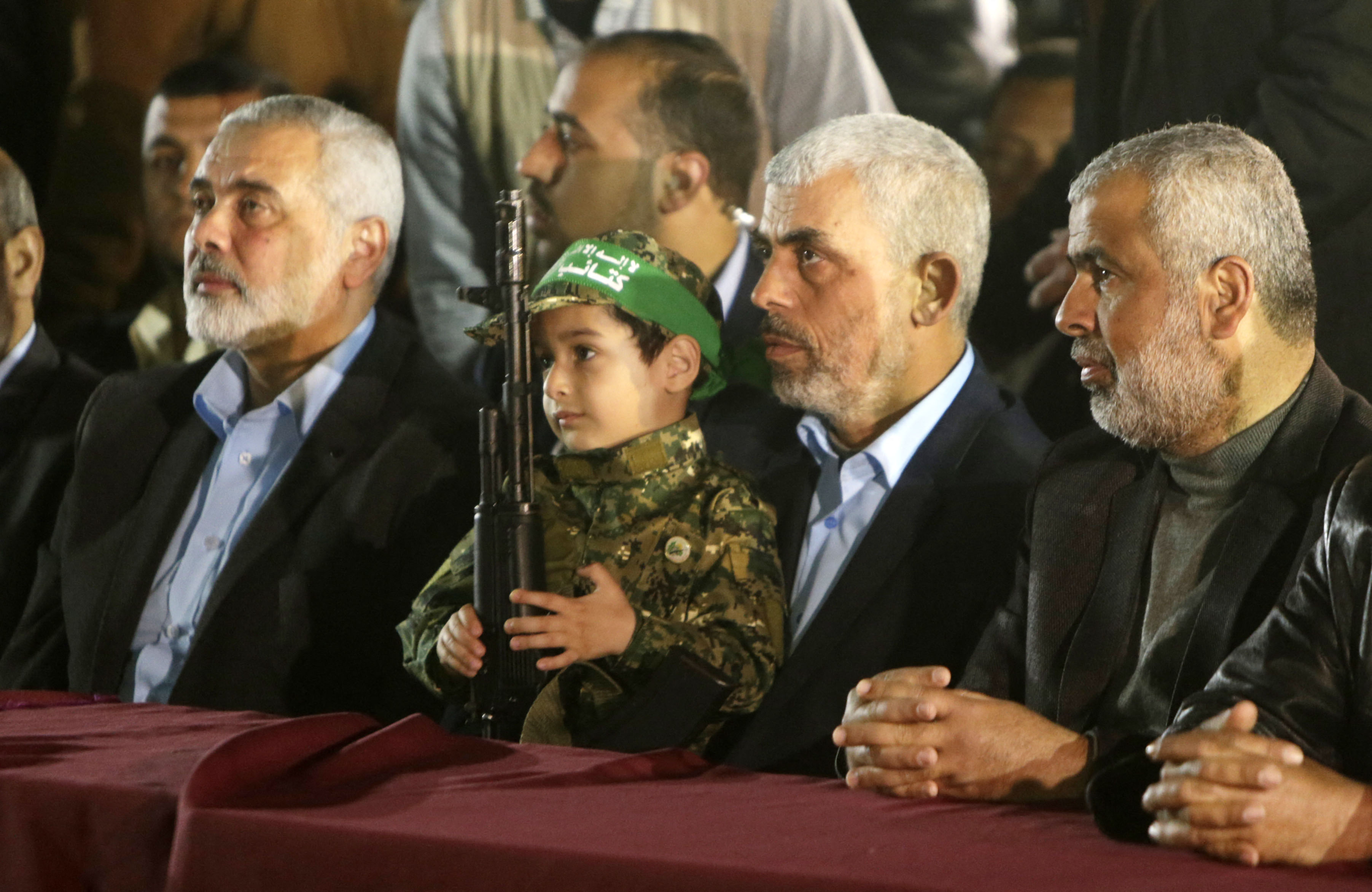 Ismail Haniyeh (L), political leader of Hamas, next to Yahya Sinwar (C), leader in Gaza