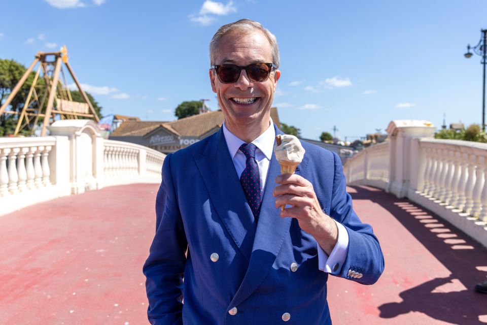 Reform UK leader Nigel Farage eating an ice cream in Clacton, Essex, on Thursday