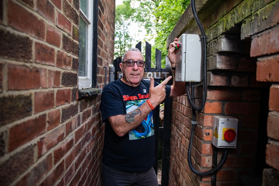 Ray operating the Air Raid Siren in his garden