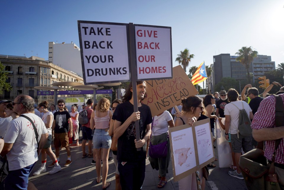 One sign at last night's protest reads 'TAKE BACK YOUR DRUNKS GIVE BACK OUR HOMES'