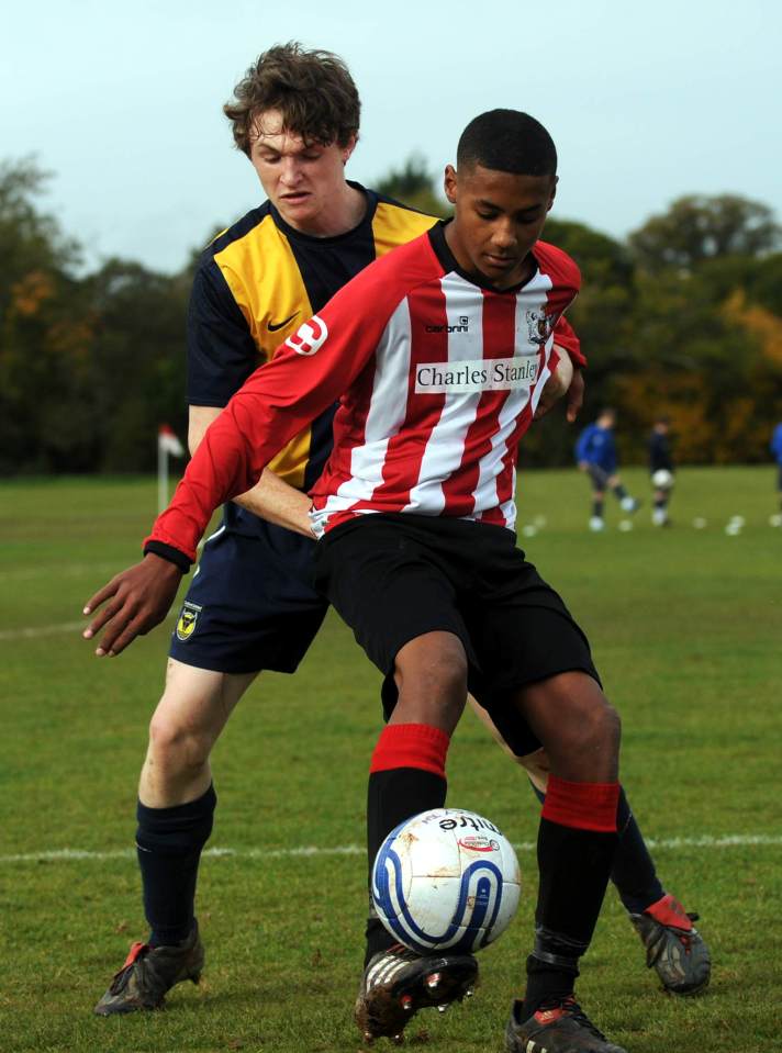 a soccer player wearing a jersey that says charles stanley on it