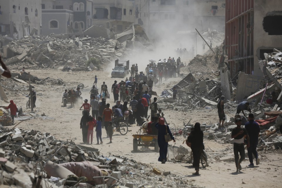 Palestinians migrate with their belongings to safer areas after the Israeli army withdraws from Khan Yunis, Gaza on July 30