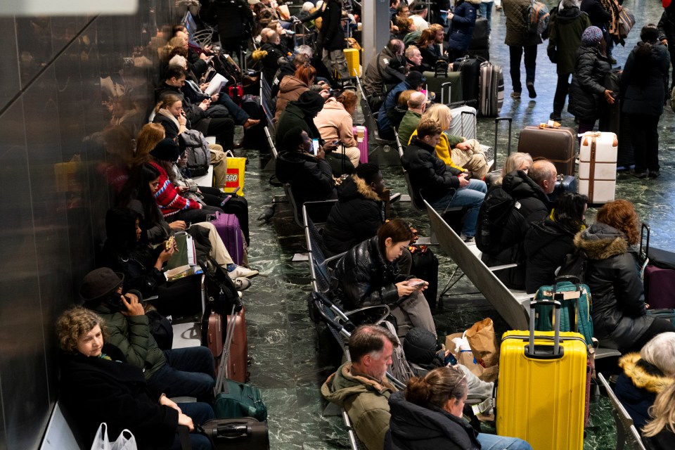 Passengers at Euston station, London (stock image)