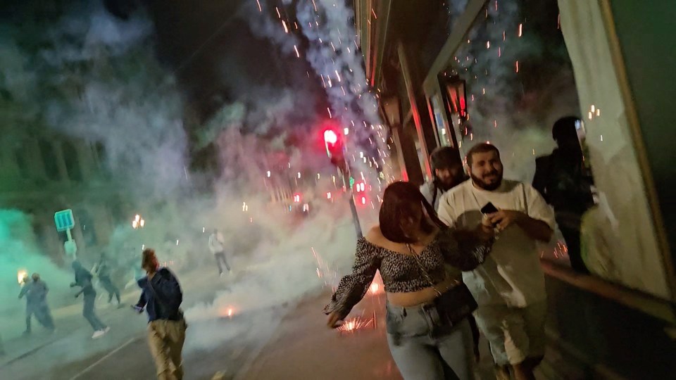 Protesters running away after police fired tear gas