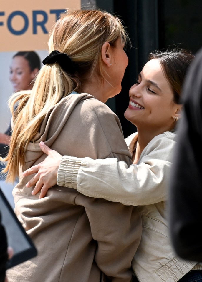 Ruxandra and Claire share a hug on set as they finish filming their location shoot