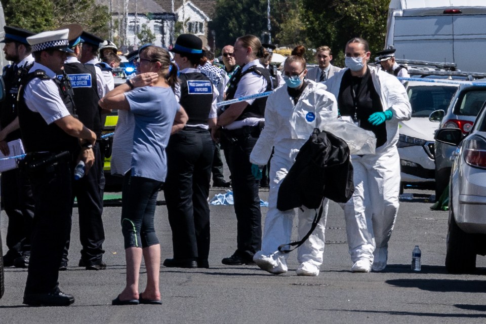 a group of police officers with the word forensics on their uniforms