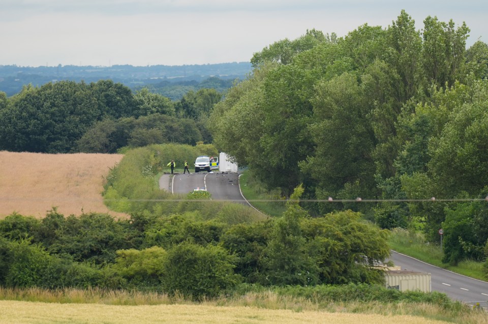 a police car is parked on the side of the road