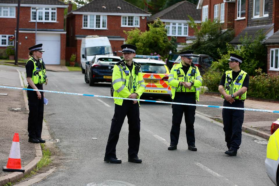 Police at the scene where the wife and two daughters of BBC reporter John Hunt died