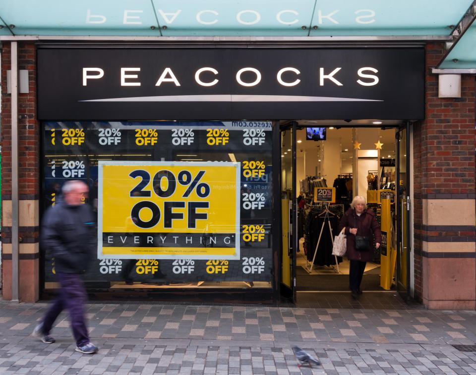 a peacocks store with a sign that says 20 % off