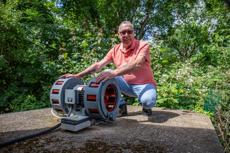 Ray stood with his air raid siren which is in his garden