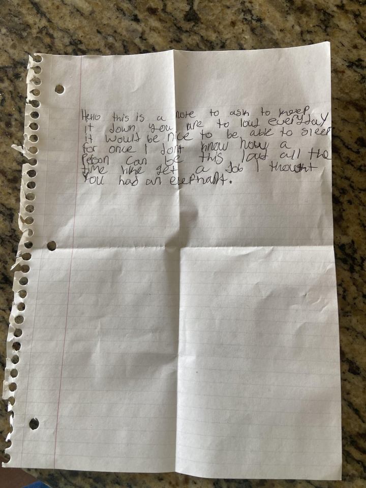 A woman was shocked by a note she found left by an angry neighbour on her door