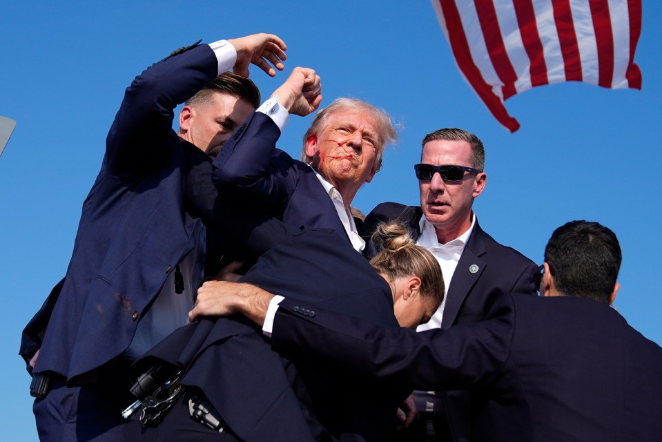 Defiant former President Trump salutes the crowd after the assassination bid