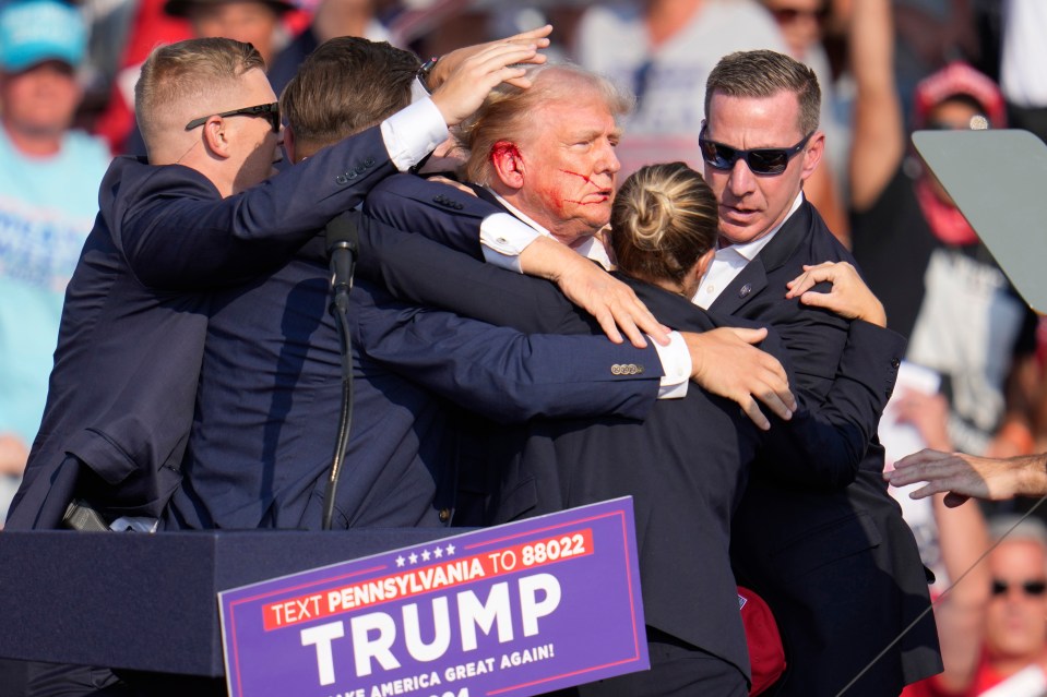 Secret Service agents scramble to cover Trump after he was shot