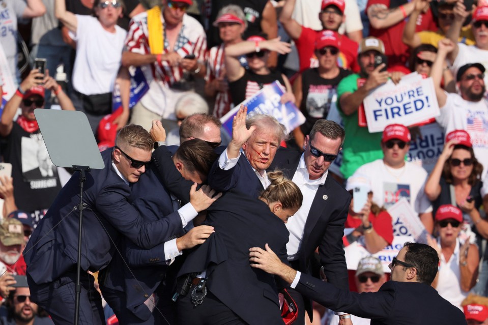 a man holding a sign that says you 're fired