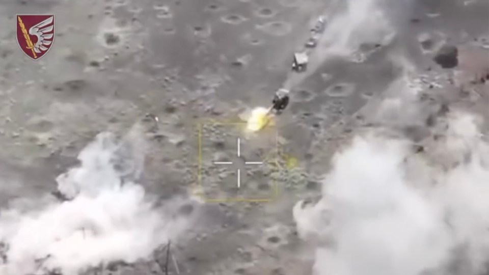 an aerial view of a rocket being launched with a cross in the middle