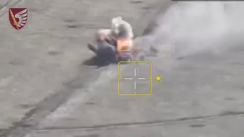 a video of a person being shot with a target in the foreground