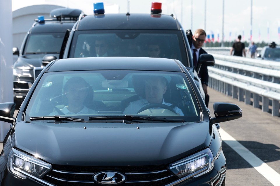 Putin made a major driving blunder while taking a spin in a black Lada Aura car