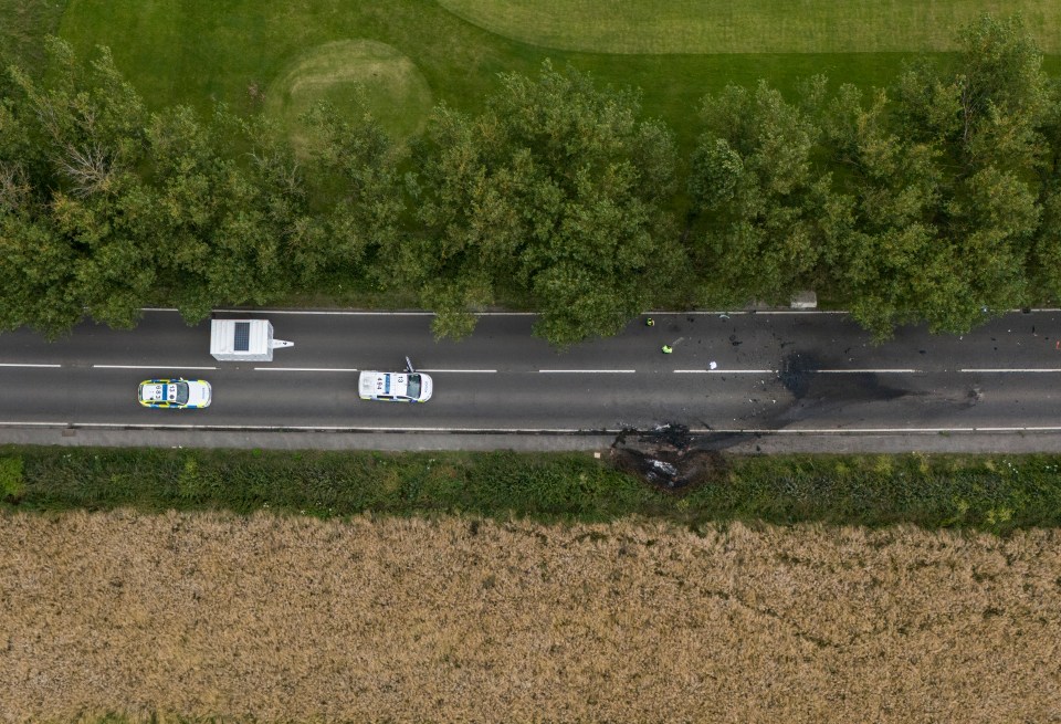 an aerial view of a police car on a road