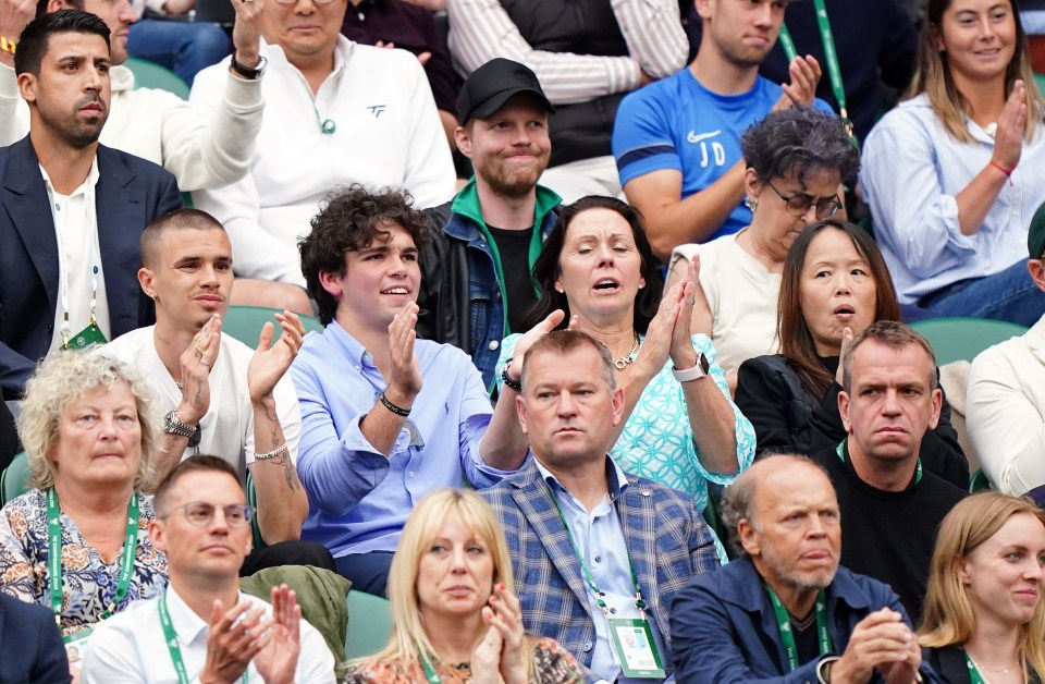 Raducanu’s mum Renee, wearing black on the right, was sat near to Romeo at the All England Club