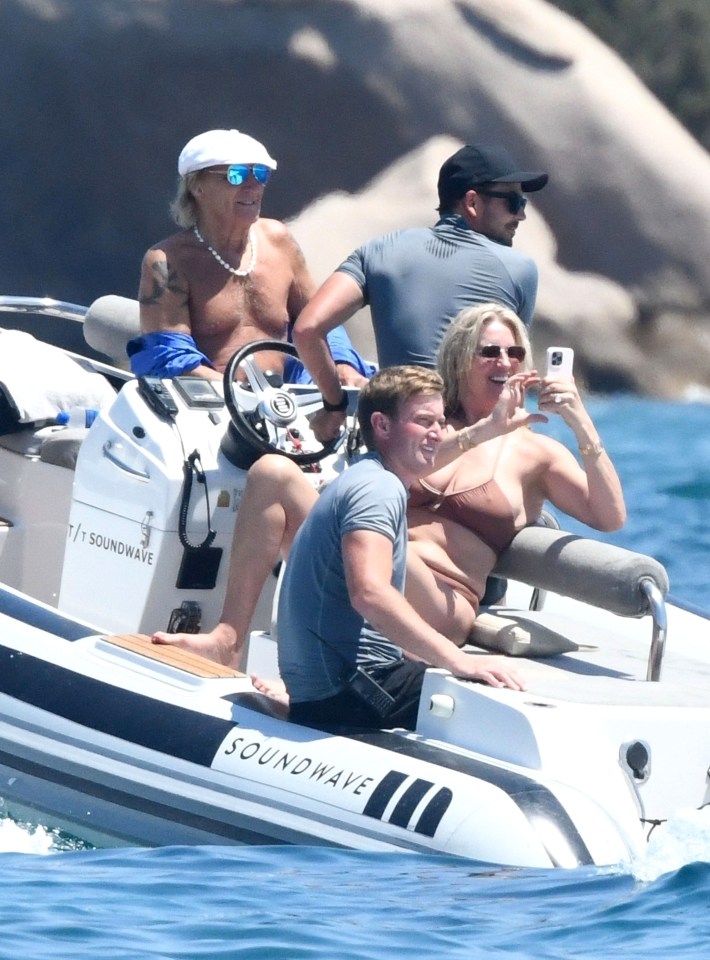 The family certainly seemed to be enjoying La Dolce Vita in the waters of Sardinia