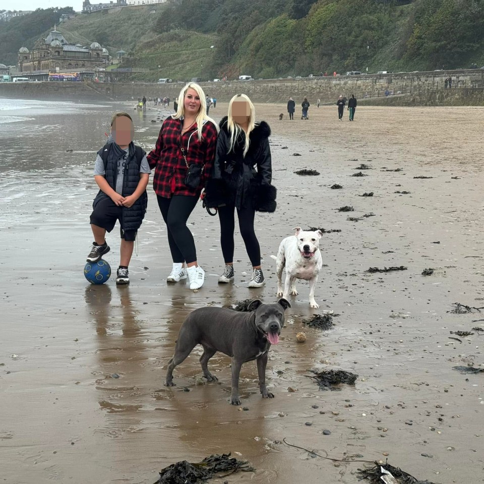 The mum with two of her children, aged 14 and nine