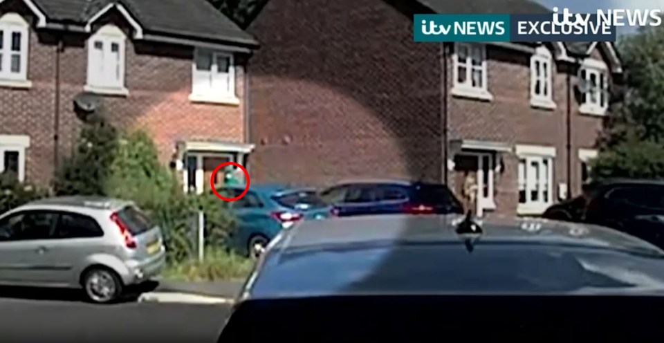 a car is parked in front of a brick house with a sign that says itv news exclusive