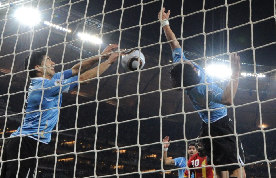 Luis Suarez handballs on the line to help knock Ghana out of the 2010 World Cup