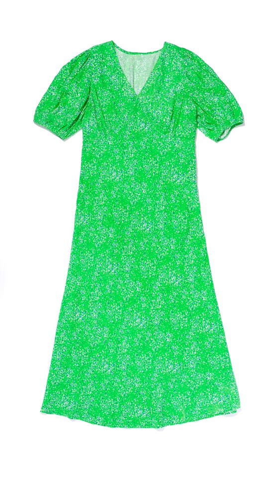 a green dress with white flowers on it