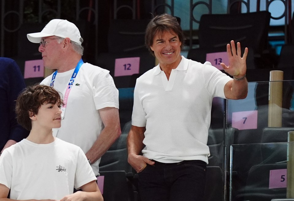 The Mission Impossible actor, 62, gave the crowds at the artistic gymnastics arena a wave