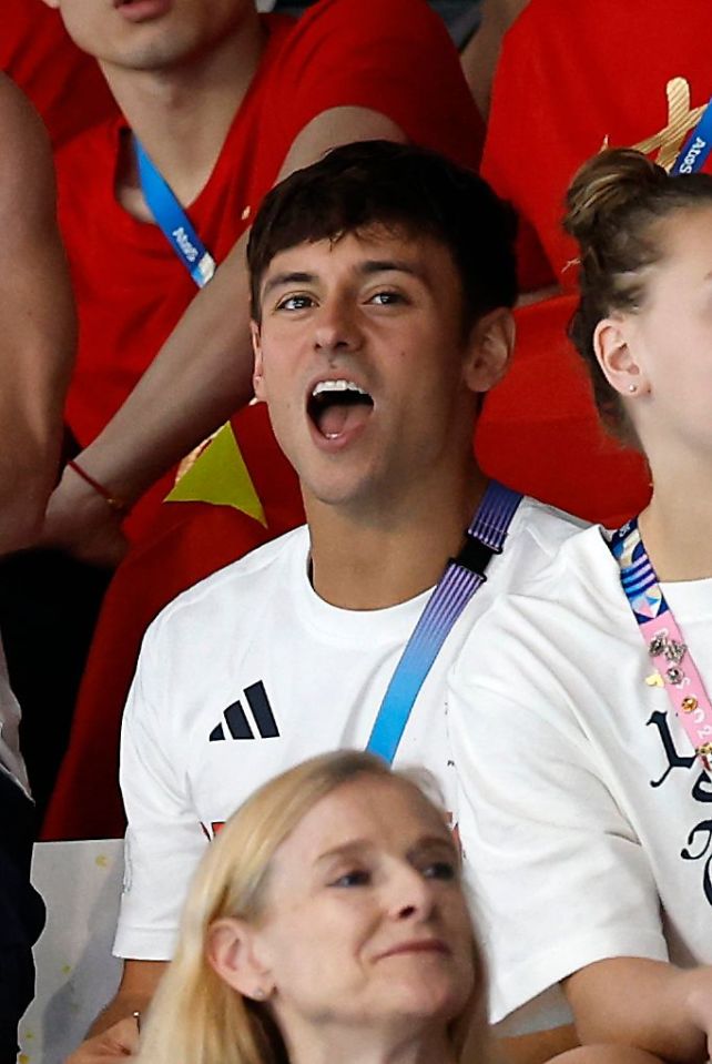 Flagbearer Tom Daley also watched from the stands after claiming silver in the men's 10m platform