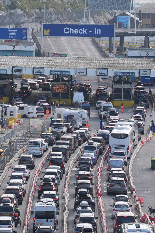 a busy highway with a check in sign in the background